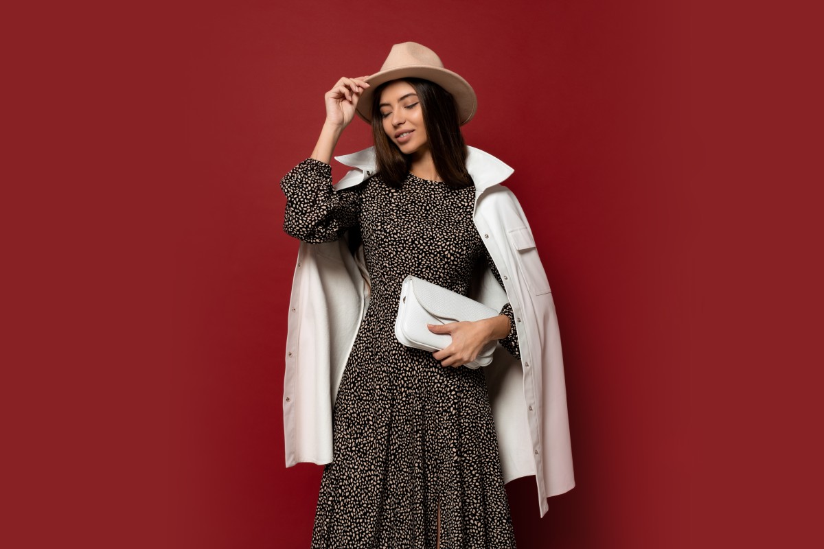 1 Dress 3 Looks 11 autumn fashion look gorgeous european brunette gir trendy white jacket dress with print posing holding leather handbag 1